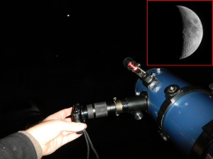 A 10 megapixel Sony pocket camera is placed against the eyepiece of a 130mm Newtonian telescope, focused on the moon.