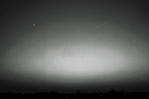 The International Space Station (the faint streak to the right of centre) passes Jupiter (the bright star to the left) at 6:42 AM, 16 November 2012.